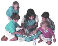 Woman reading to children