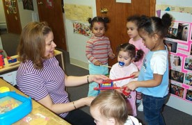 adult playing with children