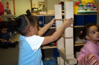 girl building with blocks