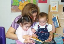 Adult and children reading together