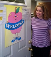 Woman standing at open door