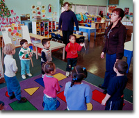 Woman in a circle with children