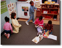 Children reading in library area