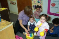 woman with three children