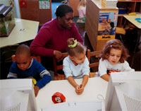 three children at separate computers