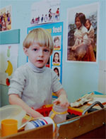 Boy doing dishes